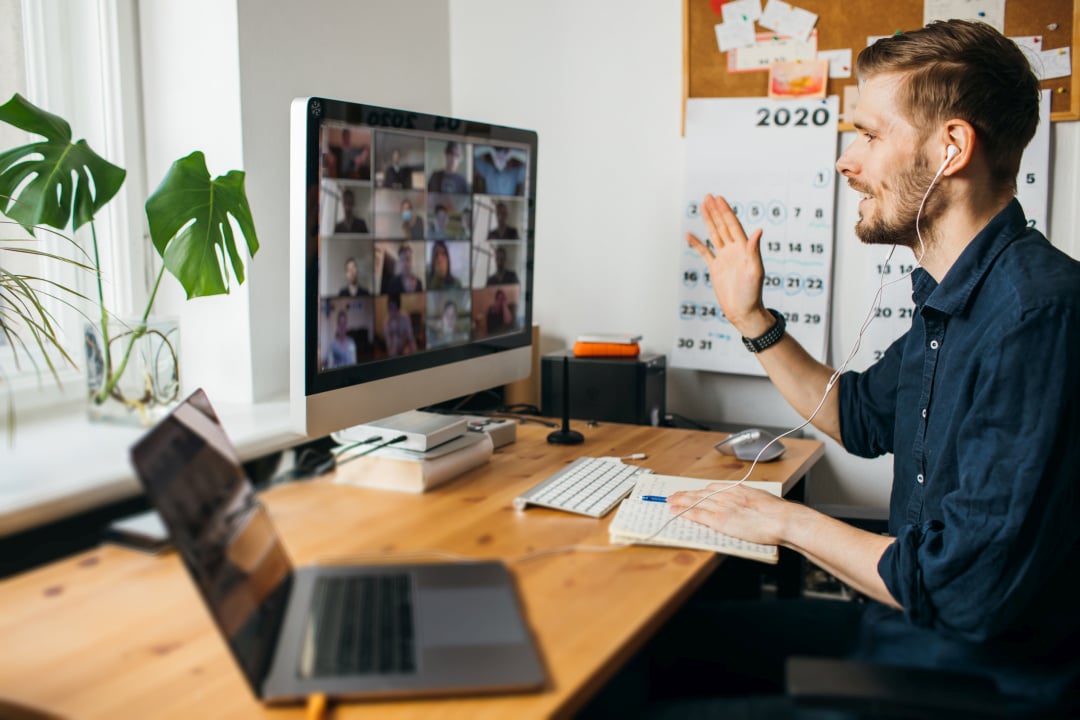 Learning into Scrum for Remote Teams - Man leading Virtual Meeting