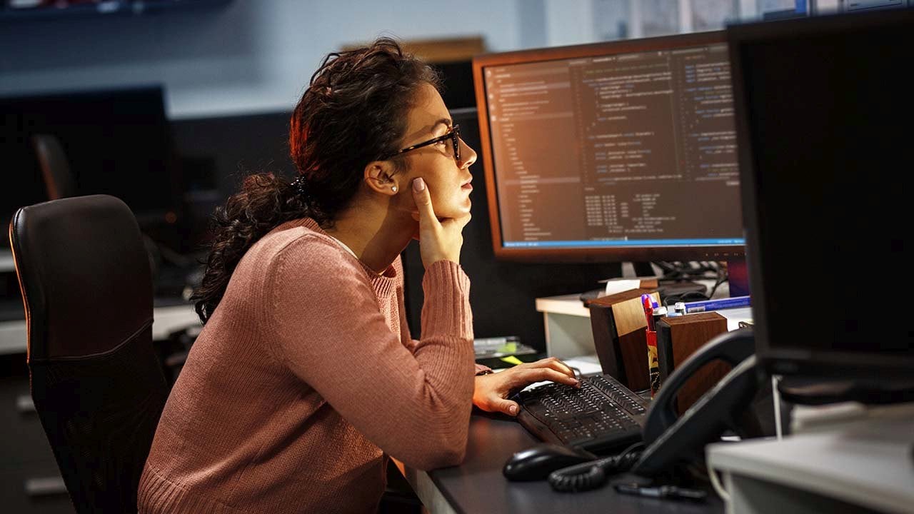 Image of Development Operations (DevOps) woman working with agile at her computer. 