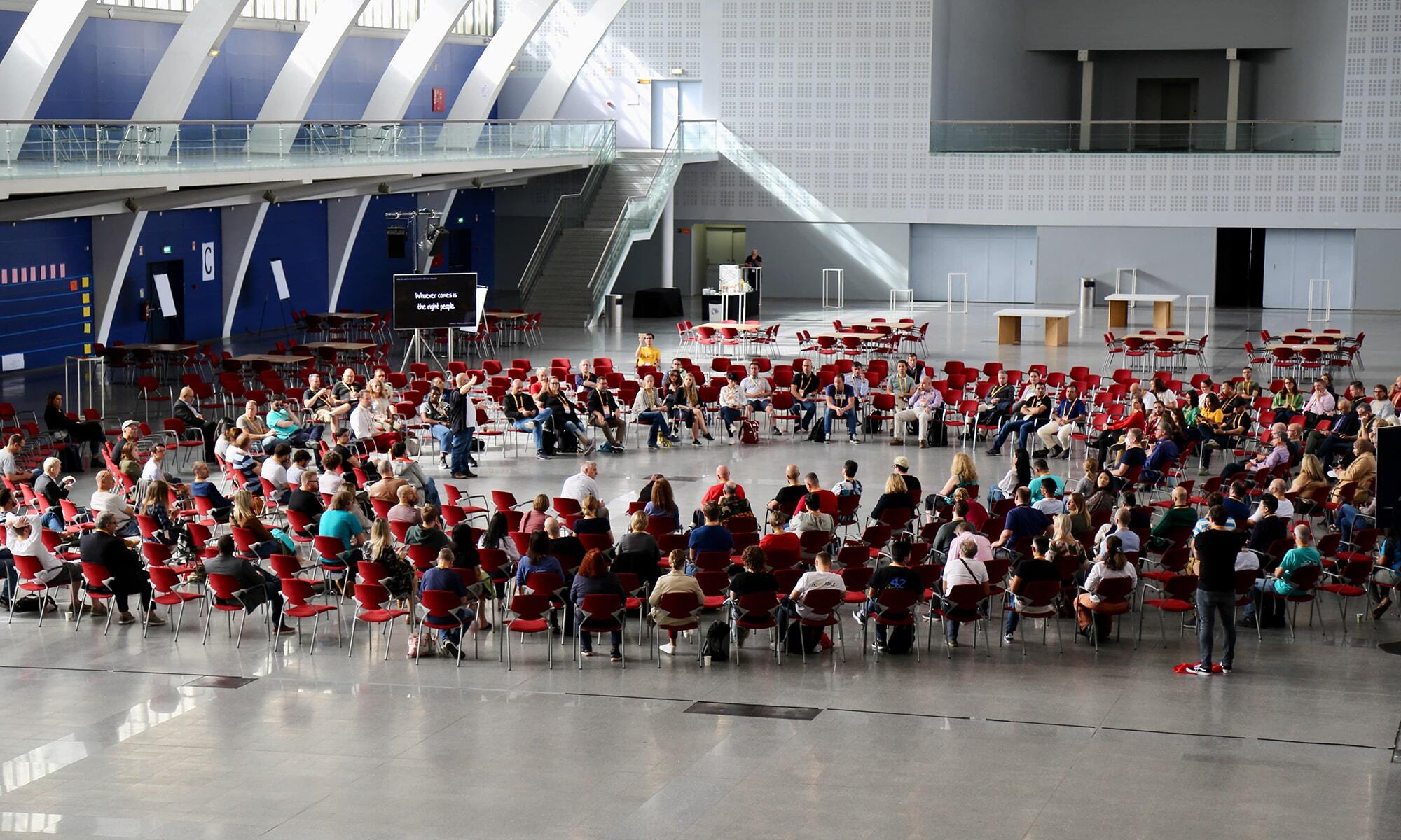 A group of Global Scrum Gathering attendees participate in Open Space